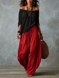 Haut Noir Off-Shoulder et Pantalon Lantern Rouge Ample